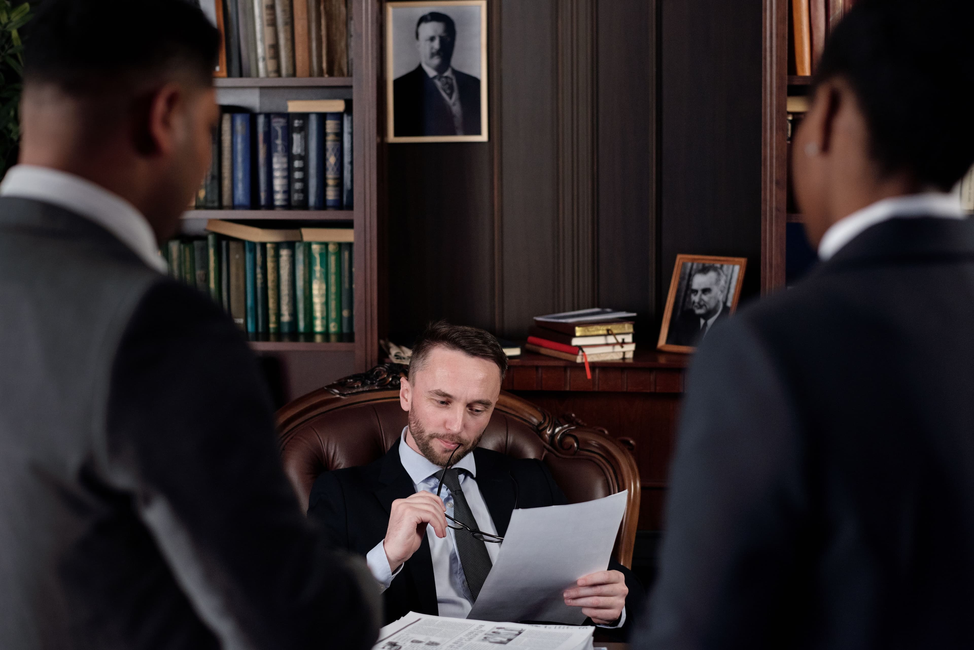 An attorney reviewing case documents in the firm's research library